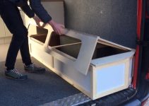 Extending, sliding, lifting bed with storage for camper van conversions
