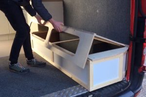 Extending, sliding, lifting bed with storage for camper van conversions